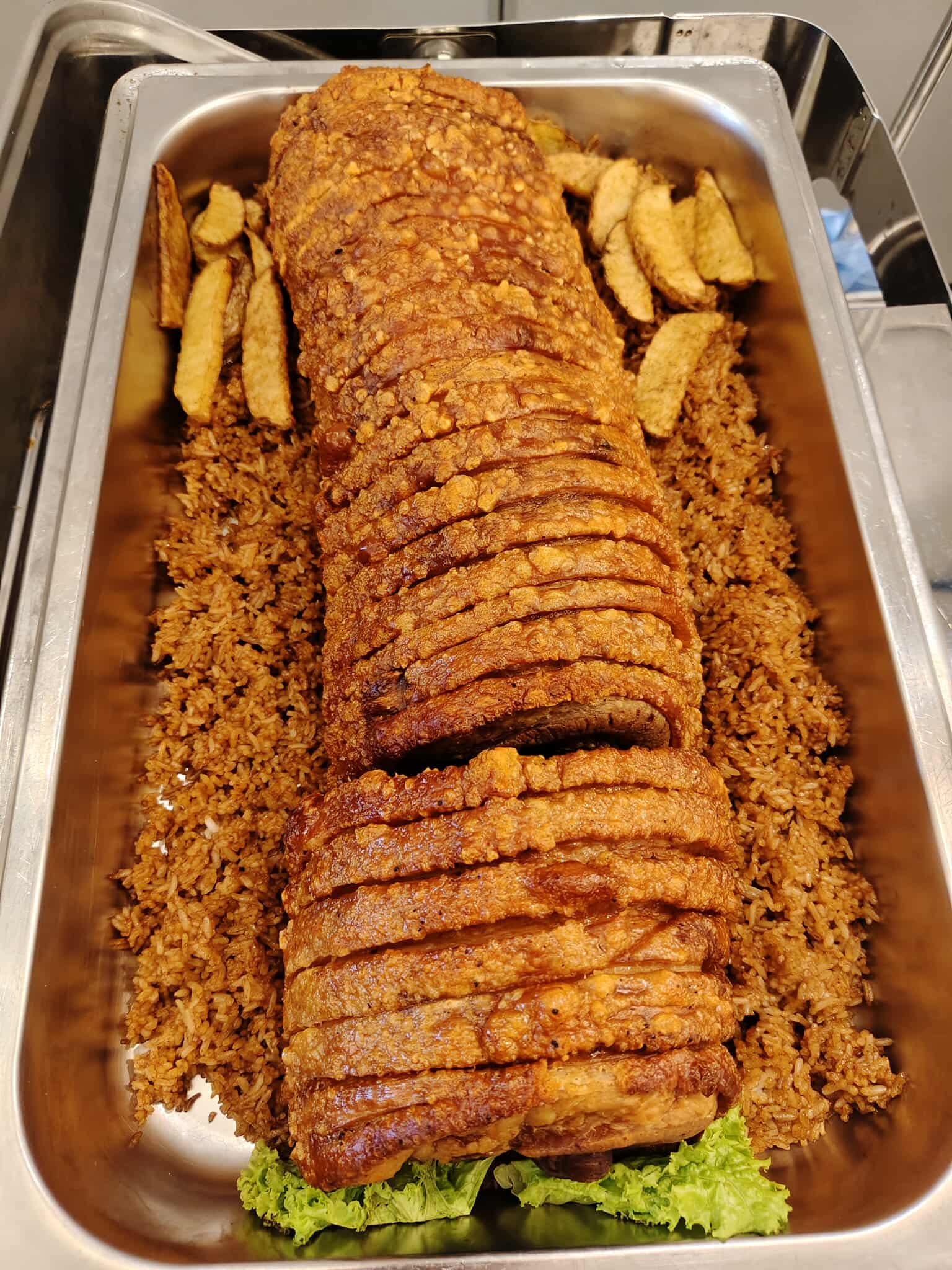 Lechon style roast pork roll sliced over fried rice