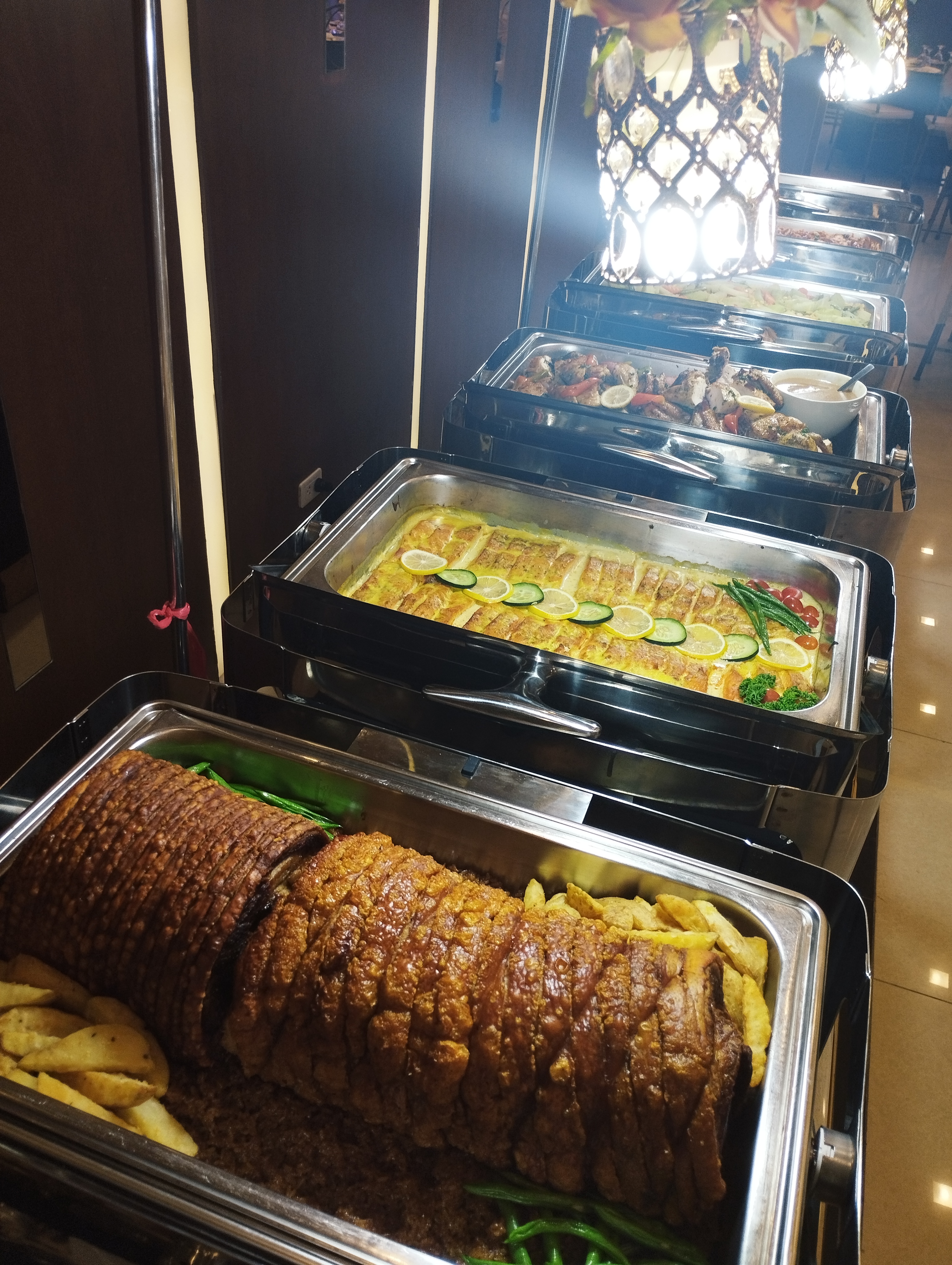 Alba Catering buffet spread with roast pork and grilled chicken