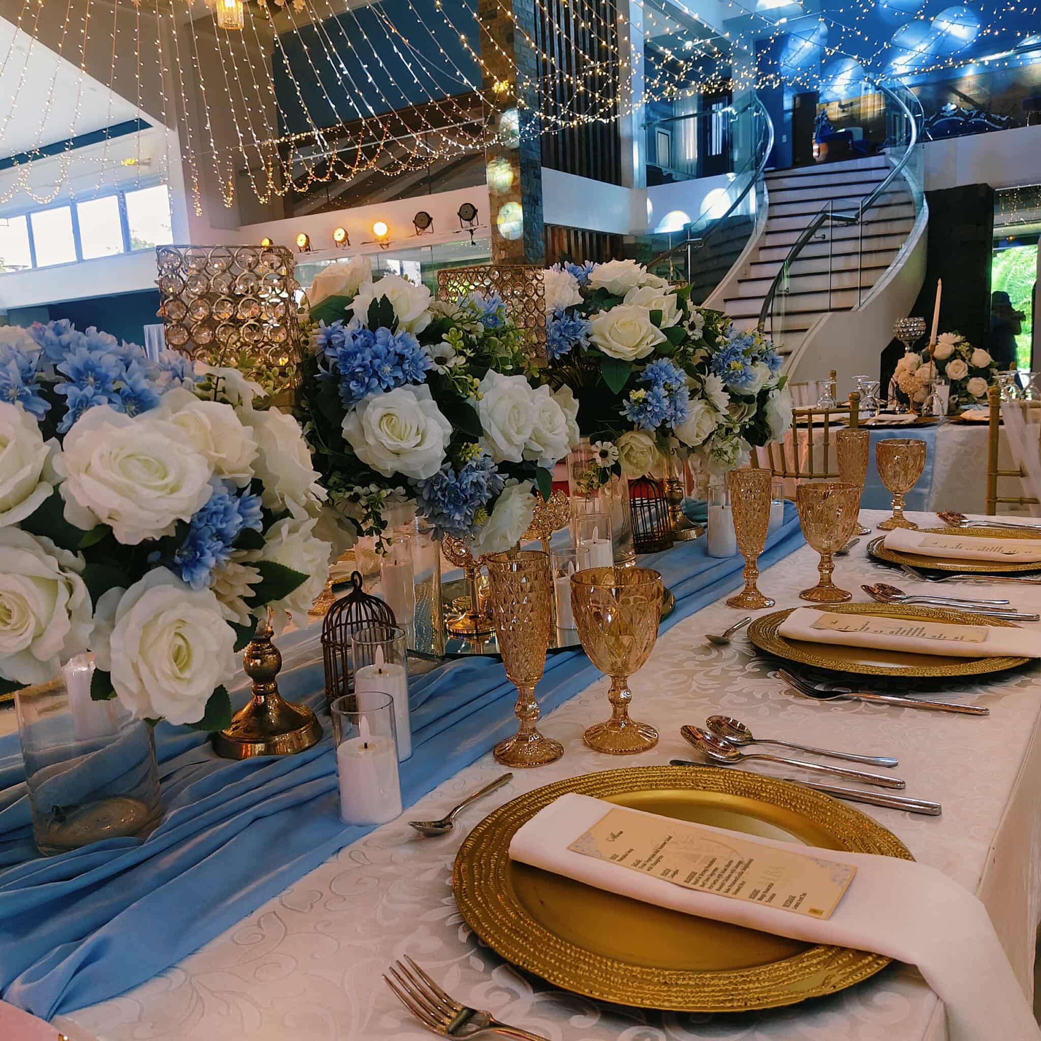 Blue and gold reception table setting detail