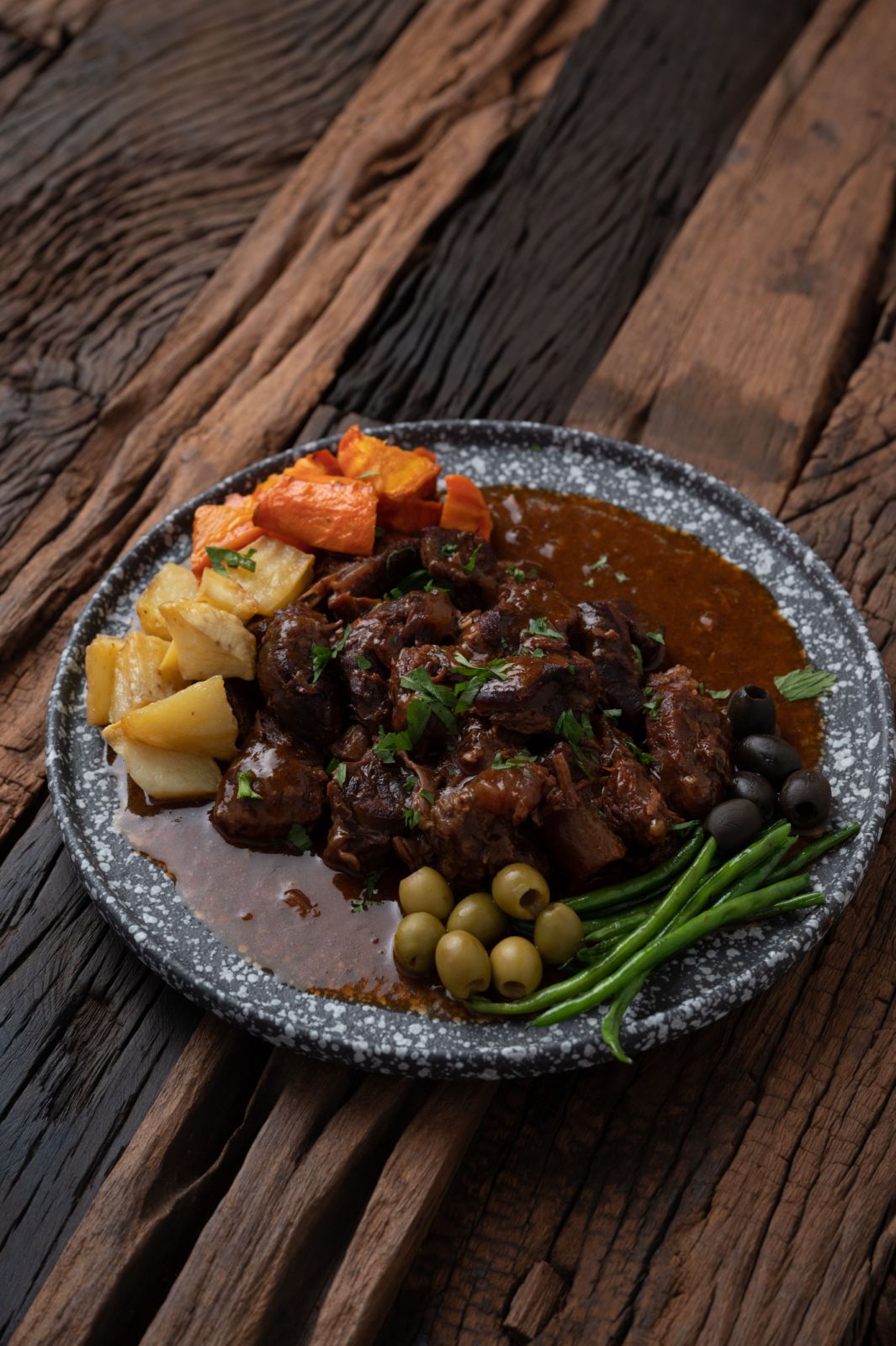 Braised beef kaldereta plated dish